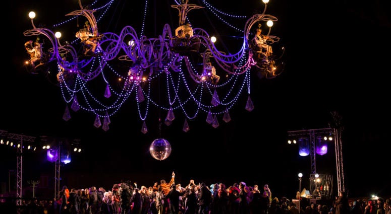 The musicians of the French troupe Transe Express play instruments on a steel chandelier. The musicians of the French troupe Transe Express play instruments on a steel chandelier.